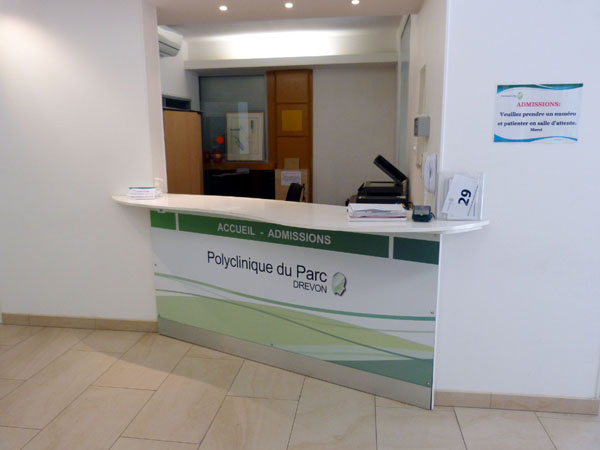 Introduce yourself to the reception desk on your right