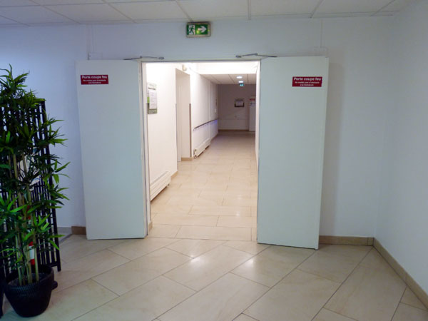 Then turn right and walk down the hall